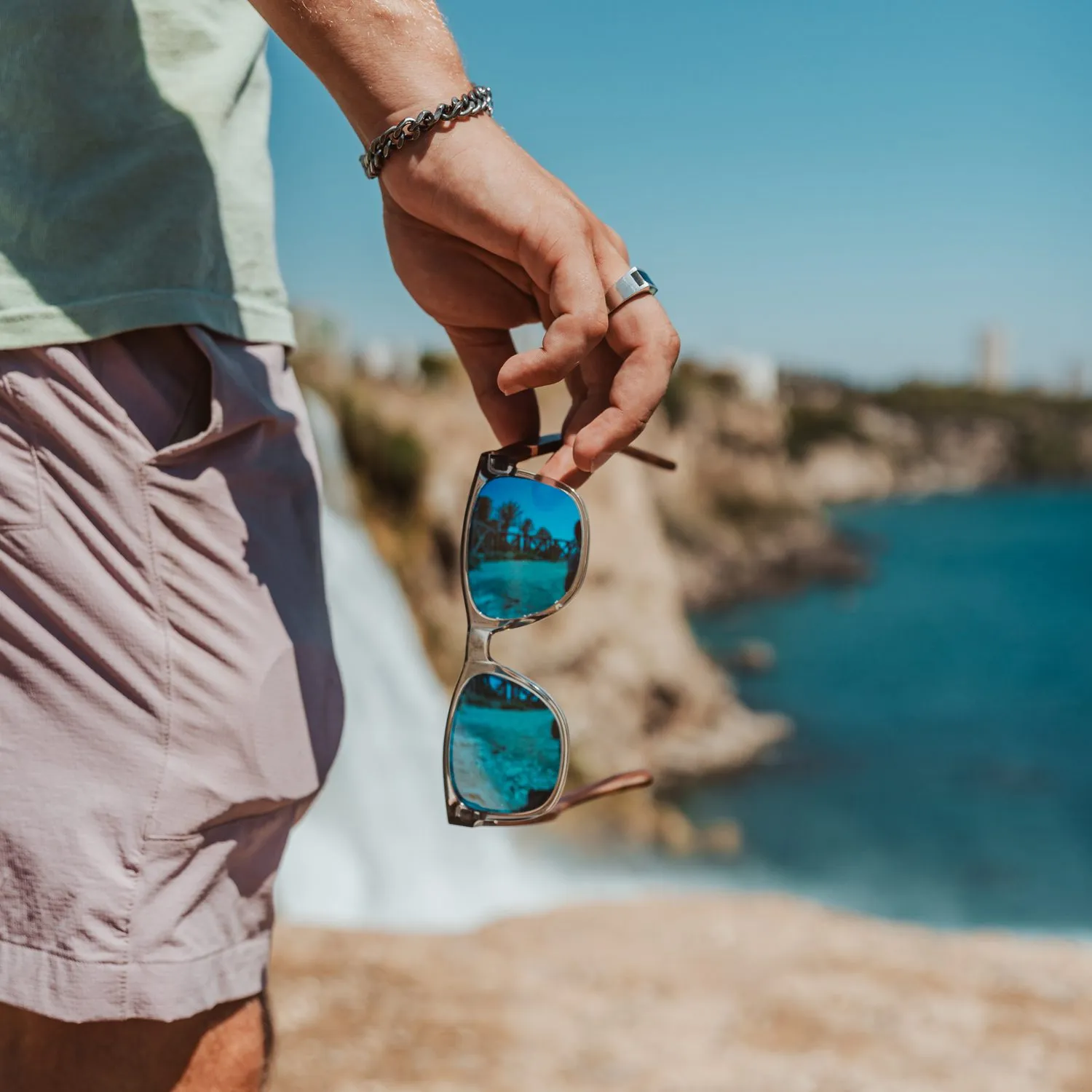 Walnut wood classic style sunglasses with semi-transparent grey frame and blue mirrored polarized lenses